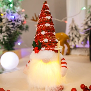 Glowing Christmas gnome ornament with red knitted hat and warm LED lights for tabletop decor