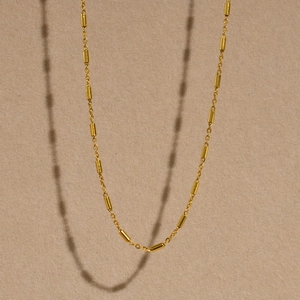 Elegant gold stainless steel necklace with delicate cylindrical links for women
