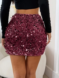 Detail view of burgundy sequin mini skirt showing shimmering texture and bodycon fit