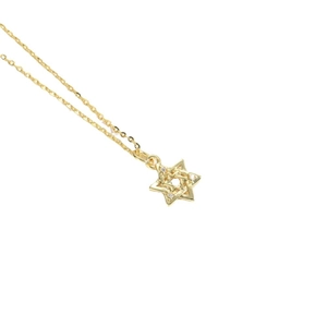 Star pendant necklace with sparkling small diamonds in gold finish minimalist style