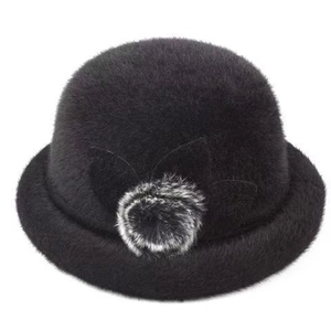 Women's black faux fur bowl hat with elegant floral decor and soft plush pompom