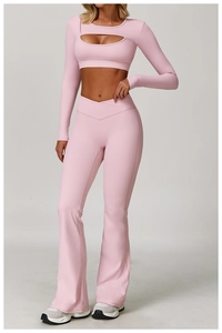 Pink contrast yoga set with cutout long sleeve top and cross waist flared pants