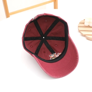 Burgundy kids baseball cap with tractor embroidery showing internal structure and strap