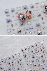 Macro detail of ultra-thin self-adhesive nail art stickers with cute rabbit and heart motifs
