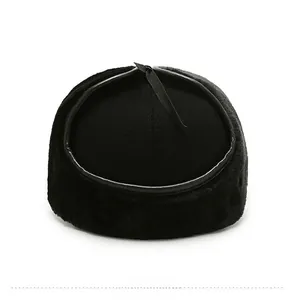 Detail view of the black plush winter hat back with ribbon tie and faux fur texture