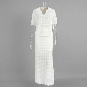 Detail of white hollow knit two-piece set featuring short sleeve polo top and maxi skirt