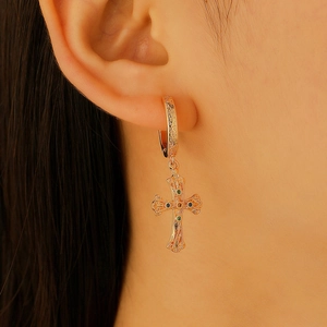 Rose gold cross hoop earrings with multi-color zircon inlay shown on ear