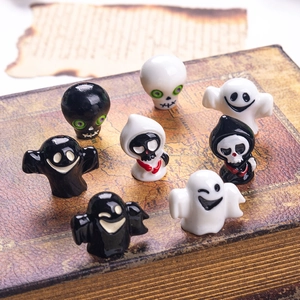 Detailed close-up of 8 mini ghost figurines on a vintage book for Halloween decor