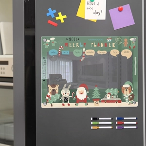 Detail showing the magnetic acrylic weekly planner with festive Christmas icons on a fridge
