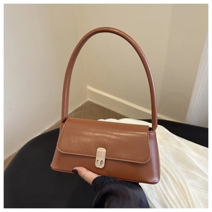 Close-up of brown PU leather baguette bag featuring a gold metal buckle and round handle
