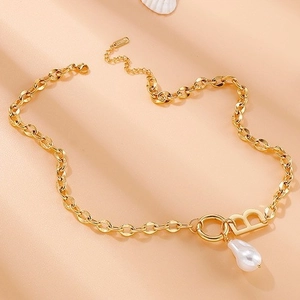 Golden capital letter B pendant necklace with baroque pearl on adjustable steel chain