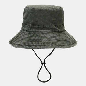 Detail view of washed cotton sun hat featuring metal eyelets and adjustable windproof cord