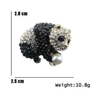 Detailed view of rhinestone panda brooch with 2.0x2.5cm dimensions and pearl accent
