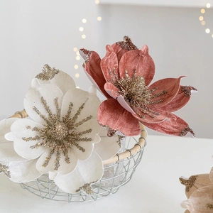 Luxurious velvet Christmas magnolia flowers in beige and pink with sparkling gold glitter