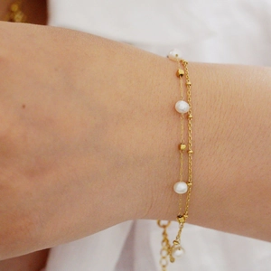 Elegant 14K gold plated double-layer pearl and bead bracelet for women on wrist