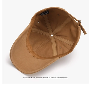 Detail view of cotton baseball cap interior with adjustable metal buckle and stitching