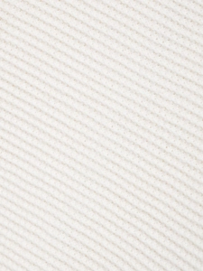 Gros plan sur la texture du tissu en maille côtelée blanc crème aux fibres tissées