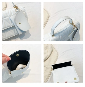 Detail view of white quilted handbag set with gold hardware and mini coin purse