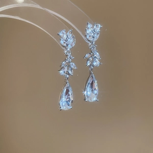 Detail of silver tassel earrings with sparkling marquise and pear cut cubic zirconia
