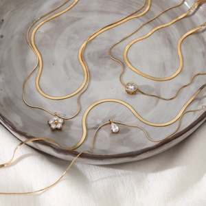 Double layered gold plated stainless steel necklace set with sparkling zircon pendants