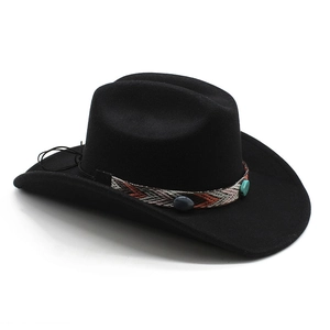 Detailed view of black felt cowboy hat with ethnic woven band and turquoise beads decoration