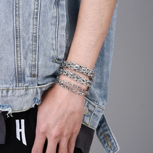Three men's silver stainless steel Byzantine chain bracelets in different widths