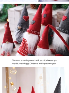 Close-up of handmade Christmas gnomes with felt hats and soft faux fur beards on wood