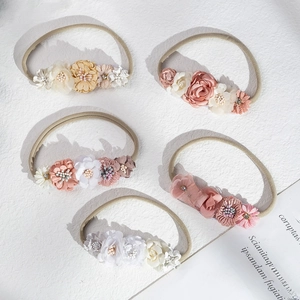 Set of five handmade floral baby headbands with rhinestones and soft nylon bands