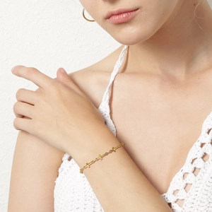 Minimalist 18K gold plated stainless steel star bracelet and hoop earrings set on model