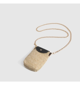 Detail of khaki straw cell phone bag with black leather flap and gold chain strap