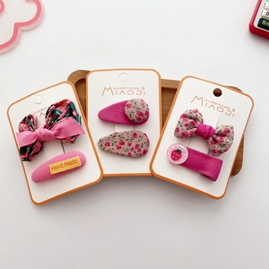 Set of six pink floral bow hair clips for girls including strawberry pattern hairpins