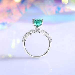 S925 sterling silver ring with emerald cut green gem and angel wing leaf design