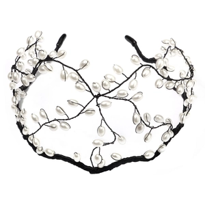Detail of handcrafted black mesh headband adorned with white pearls in a branch design