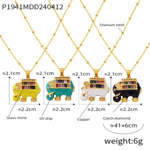 Detailed display of colorful enamel elephant pendants in yellow, green, white, and black