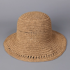 Detail of handwoven straw hat showing fine texture, khaki color, and breathable weave design