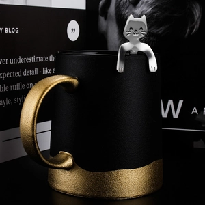 Creative black ceramic mug set with a cute silver cat-shaped stainless steel hanging spoon