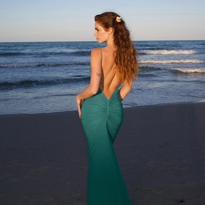 Elegant emerald green backless maxi dress with ruched details for summer beach vacations