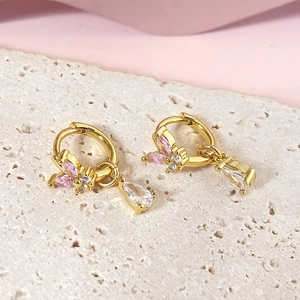Elegant gold butterfly huggie earrings with pink crystals and clear teardrop pendants