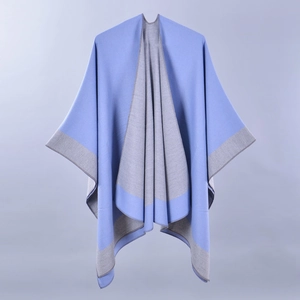 Close-up of double-sided blue and grey cashmere shawl with detailed hem edges
