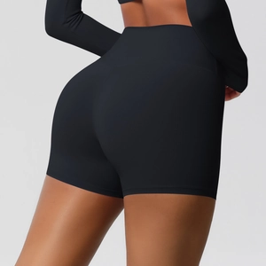 Close-up back view of high-waisted black yoga shorts showing lift and peach hip effect