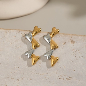 Two-tone gold and silver heart-shaped stud earrings in polished stainless steel for women