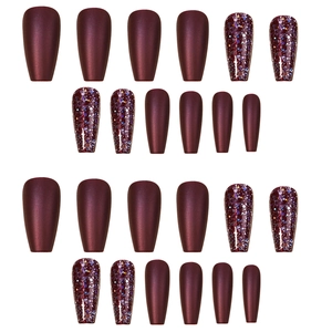 Deep burgundy press-on nails in medium square shape with glitter and matte finishes