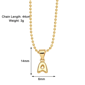 Macro view of gold letter A pendant showing exact dimensions of 14mm by 6mm