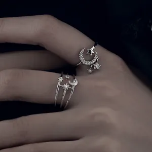 Elegant adjustable silver moon and star ring with sparkling cubic zirconia for women