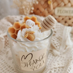 Handmade strawberry chocolate scented soy candle in glass cup with honey bee decor