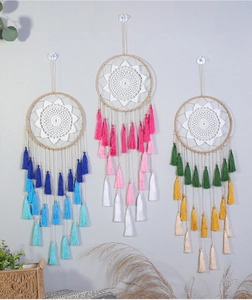 Detailed view of colorful gradient tassel dreamcatchers in blue, pink, and green tones