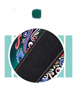 Detail of ZHIDAO embossed leather strap with artistic colorful patterned background