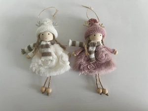 Detail view of pink and white knitted Christmas angel hanging ornaments with antlers