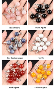 Macro shot of 12mm gemstone wizard hat pendants in rose quartz and agate for DIY jewelry