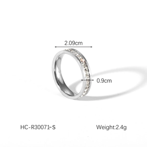 Detail view of silver stainless steel ring showing 0.9cm width and zircon inlay